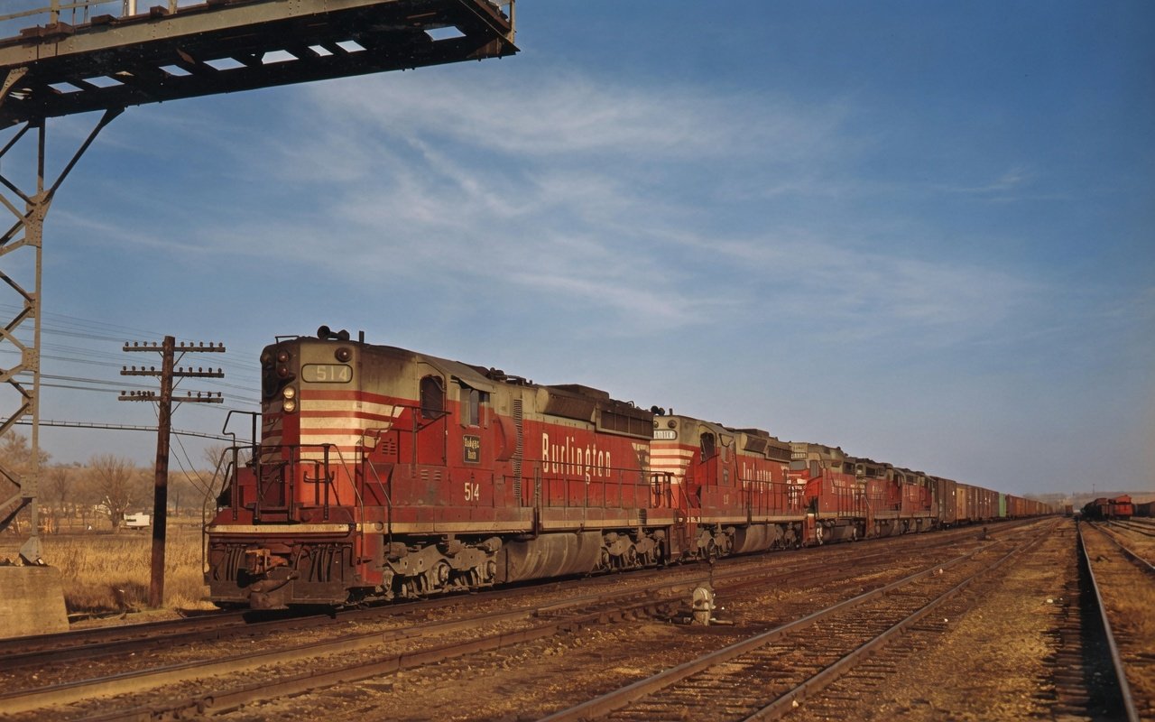 Burlington SD24 514 leading a freight in the Chinese-red scheme
