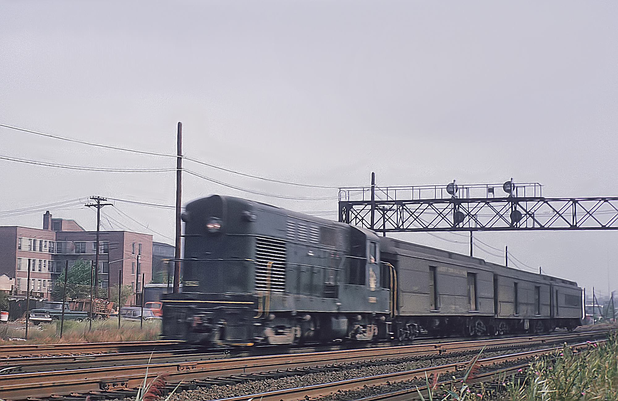 Jersey Central H15-44 with train 1414 at 45th Street in Bayonne New Jersey in August 1964