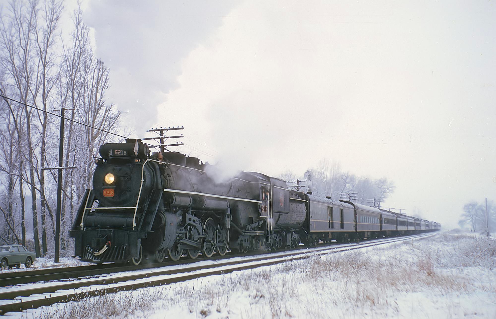 Canadian National 4-8-4 6218 class U-2-g fan trip over Grand Trunk Western at Stillwell Indiana November 20 1966