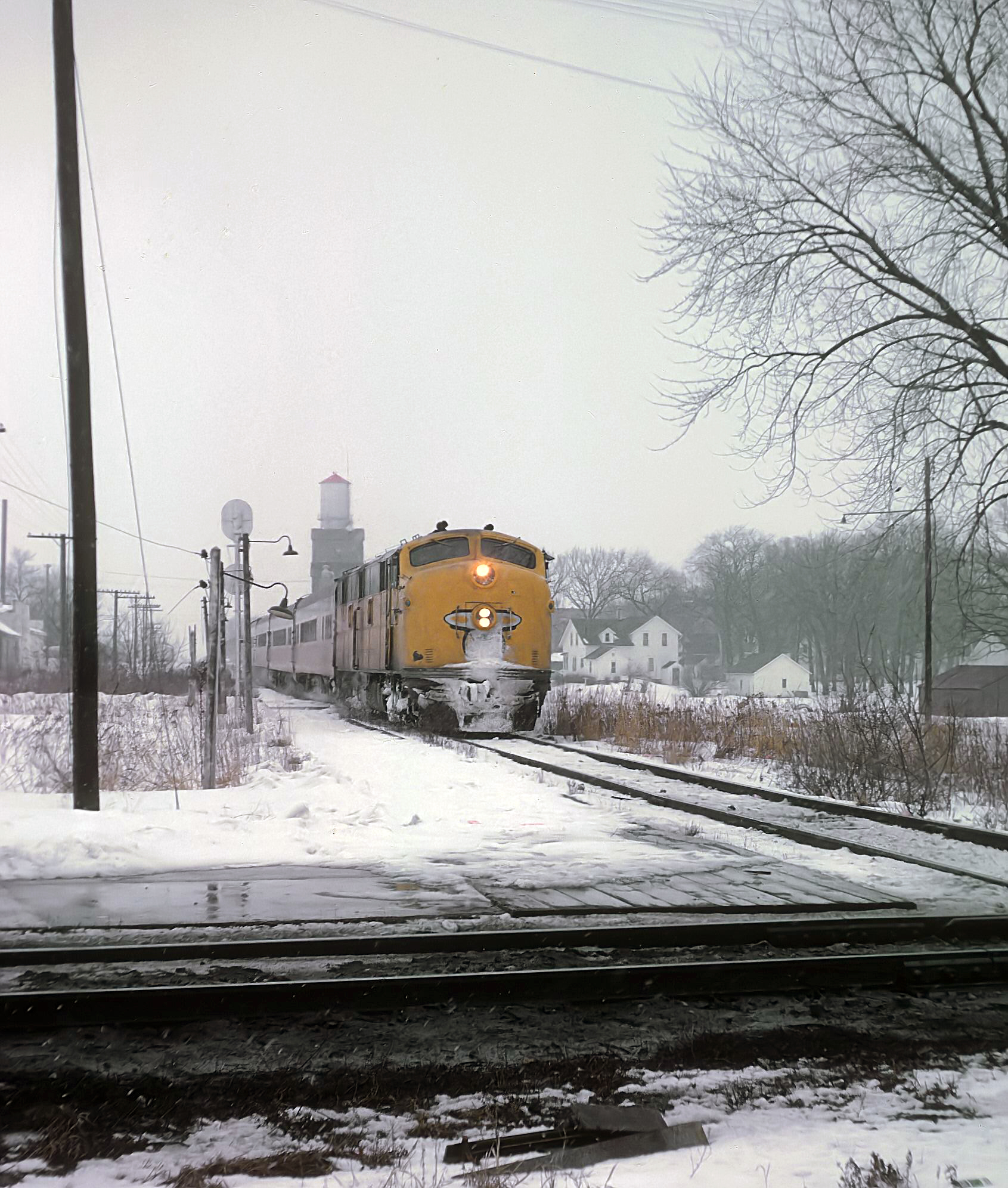 Chicago and North Western Rochester 400 about to cross the Chicago Great Western at Dodge Center Minnesota March 11 1963