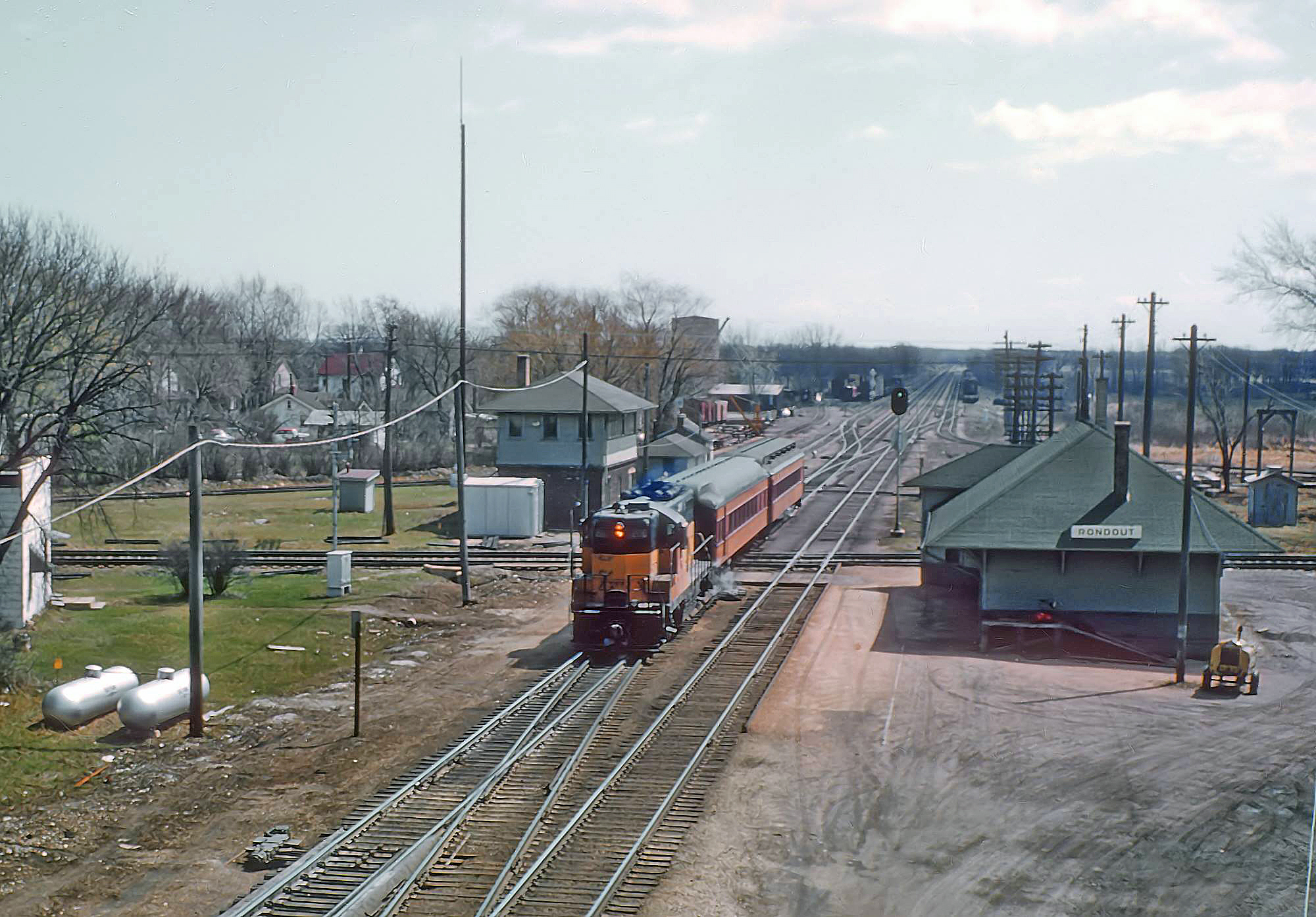 Milwaukee Road GP9 200 with train 113 at Rondout, Illinois, in April 1962