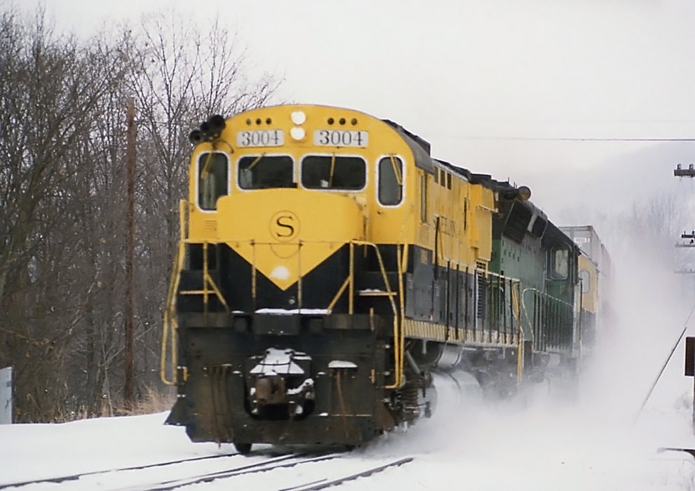 Susquehanna C430s 3004 and 3006 with SD45 6360 on eastbound Sea-Land NTV-4 at Oakland Pennsylvania February 16 1986 Doug Kroll