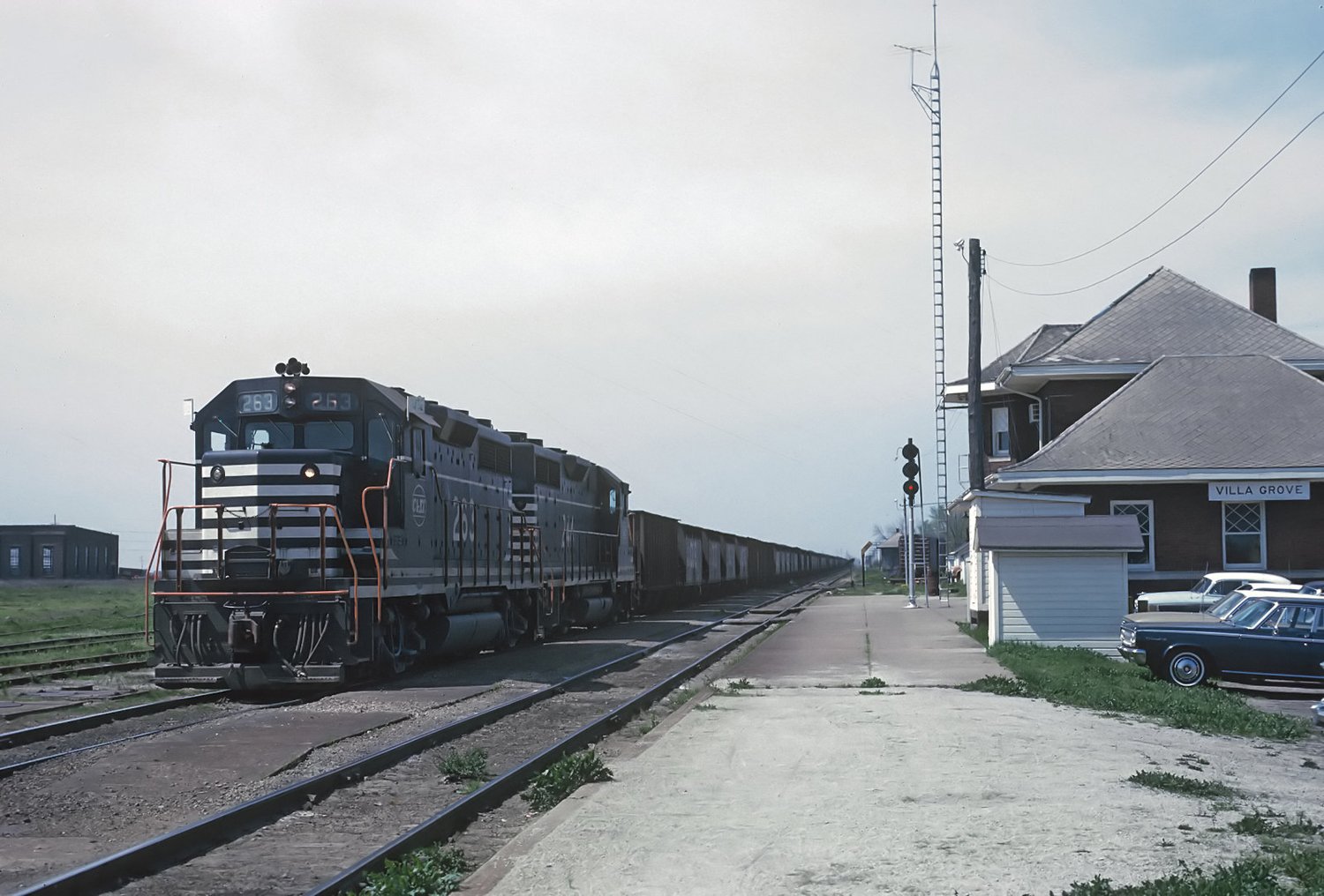 Two Chicago and Eastern Illinois GP35s with hoppers at the Villa Grove depot on May 7, 1966