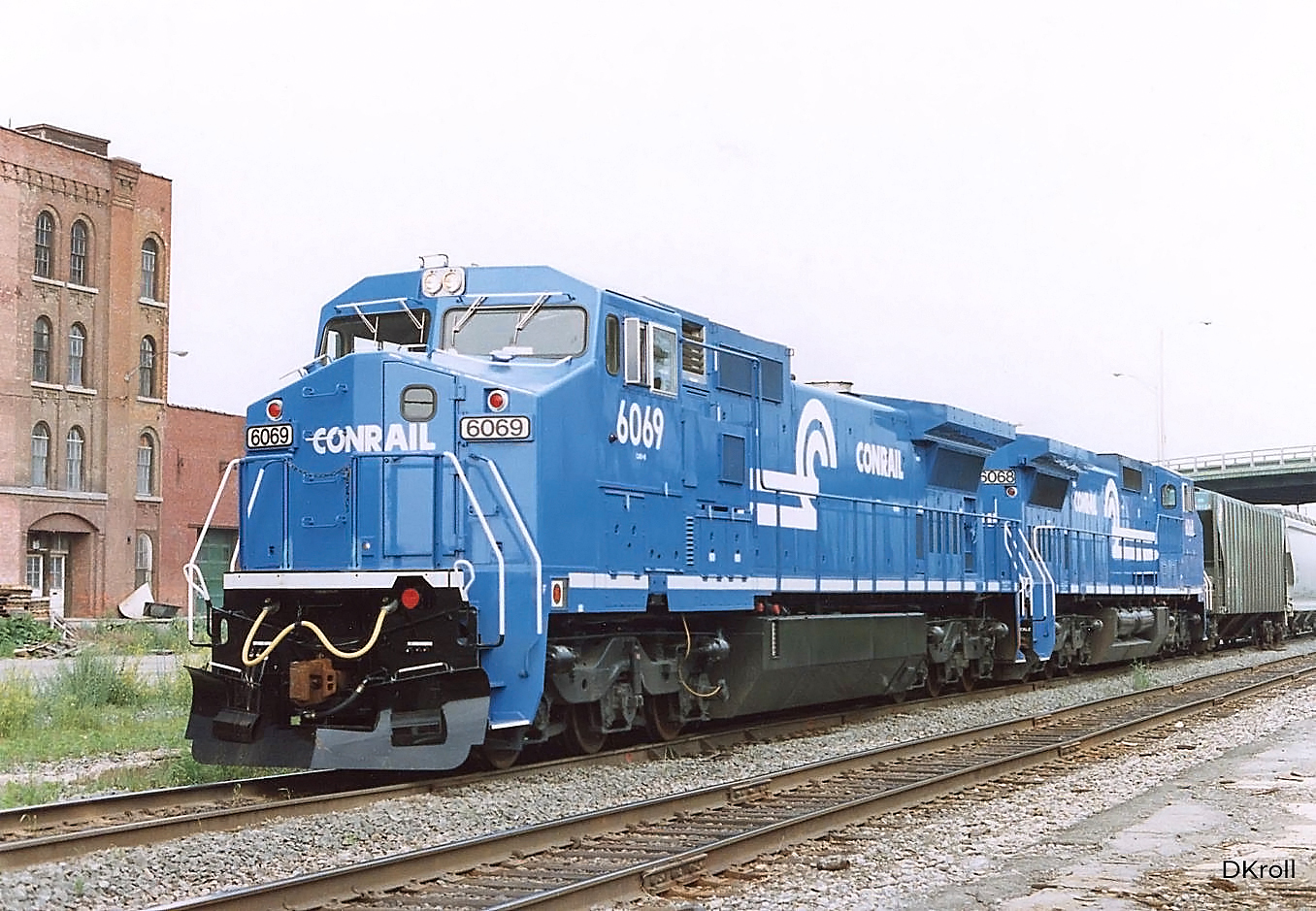 Recently delivered Conrail C40-8Ws 6069 and 6068 on westbound train OIBU at Binghamton New York June 16 1990