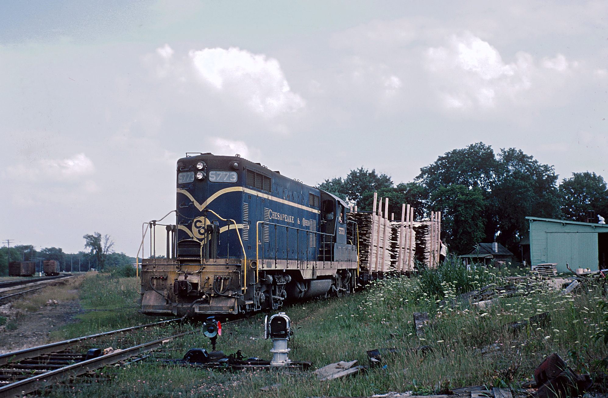 Chesapeake and Ohio GP7 5773 switching Reed City Lumber in Reed City Michigan in August 1962