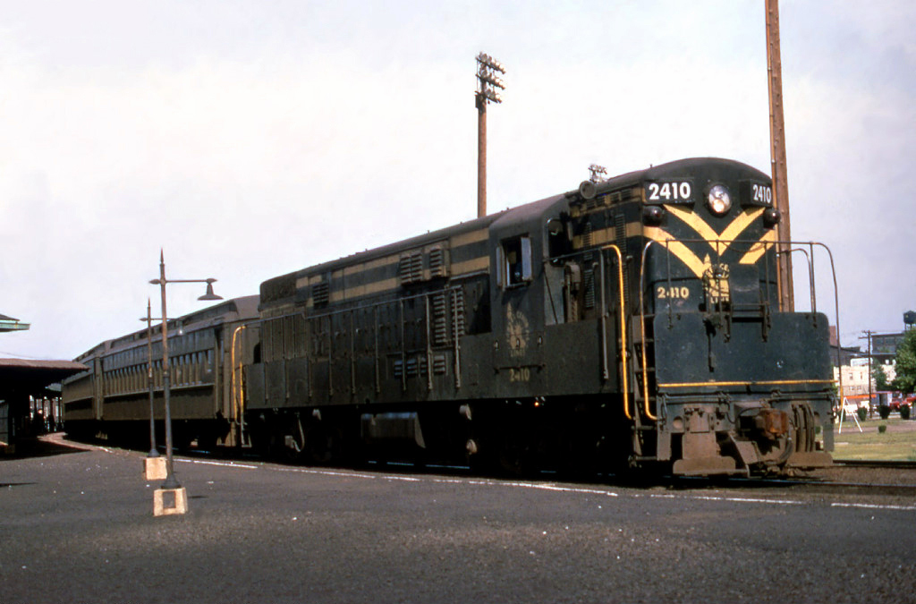 Jersey Central H24-66 Train Master 2410 working commuter service at Matawan New Jersey in the summer of 1967