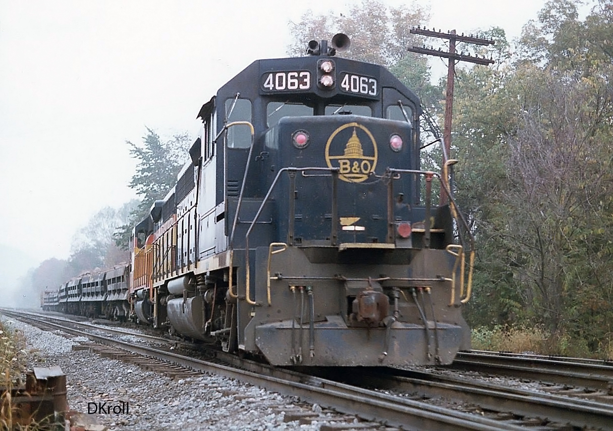 Baltimore and Ohio GP40 4063 leading a ballast train near Hyndman Pennsylvania October 15 1984