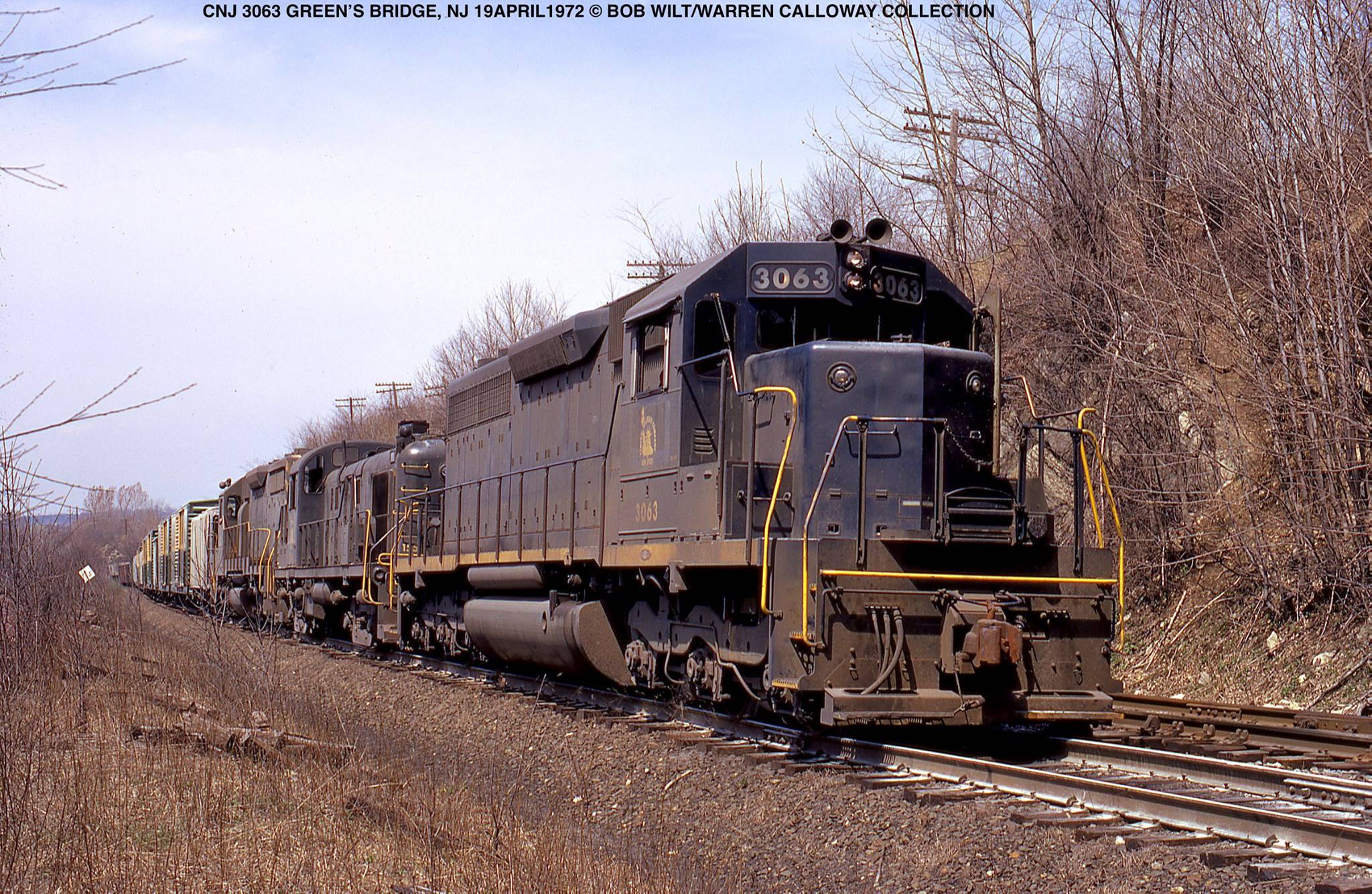 Jersey Central SD40 3063 leading an eclectic lash-up at Greens Bridge New Jersey on April 19 1972