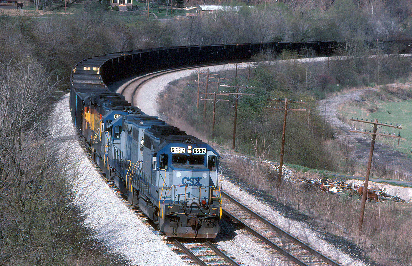 Four CSX Geeps led by GP40 6592 with empty coal train B875 at Pinto Maryland