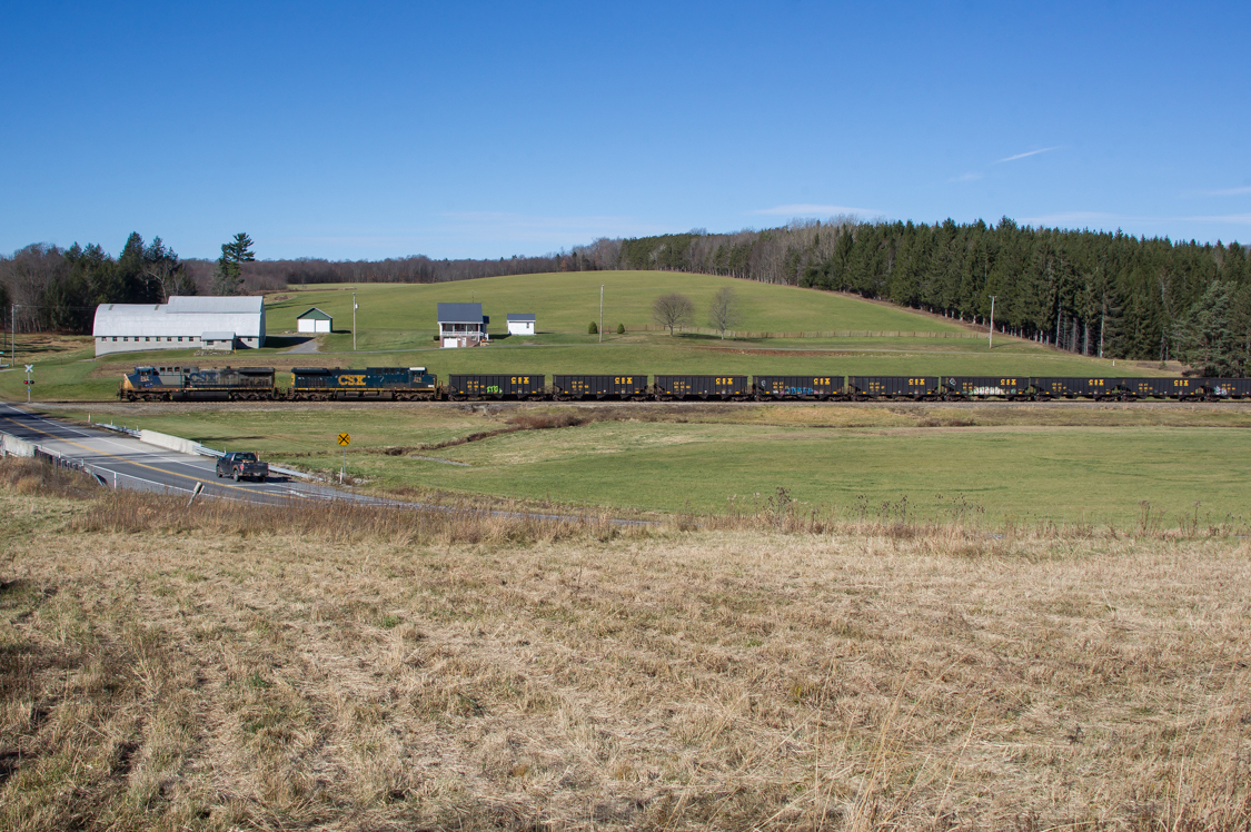 CSX AC4400CWs led by 262 with empty hoppers on the Coleman Branch at Shanksville Pennsylvania November 15 2023
