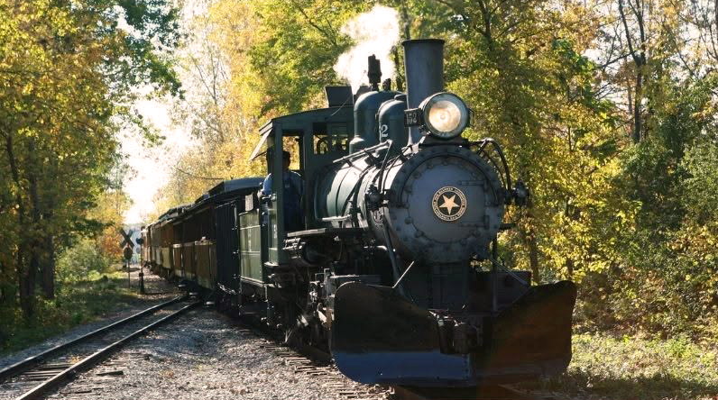 Huckleberry Railroad narrow gauge steam train fall colors Crossroads Village
