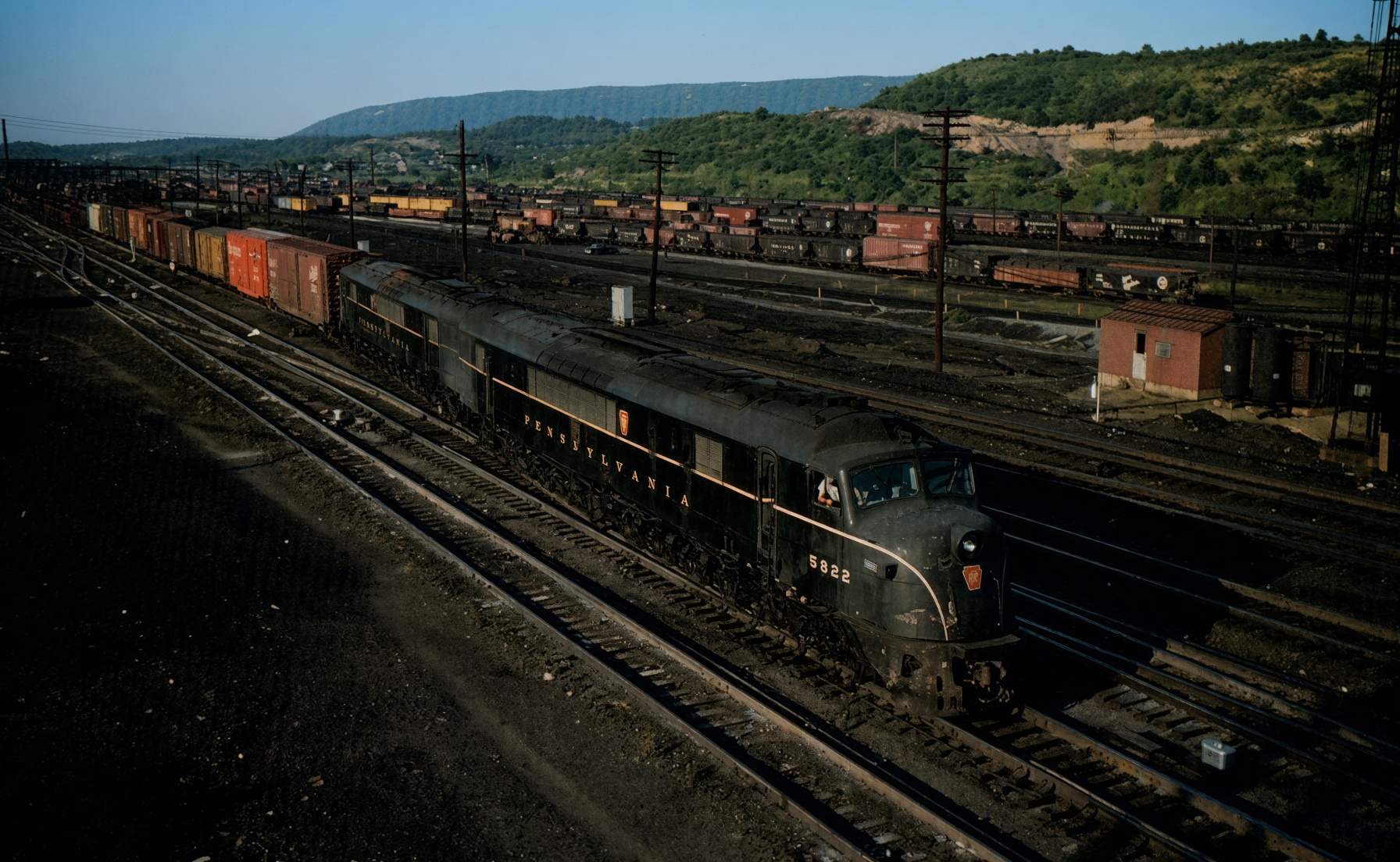 Pennsylvania Railroad Centipede 5822 and a second Centipede on a westbound freight at Altoona Pennsylvania in July 1960 David Sweetland