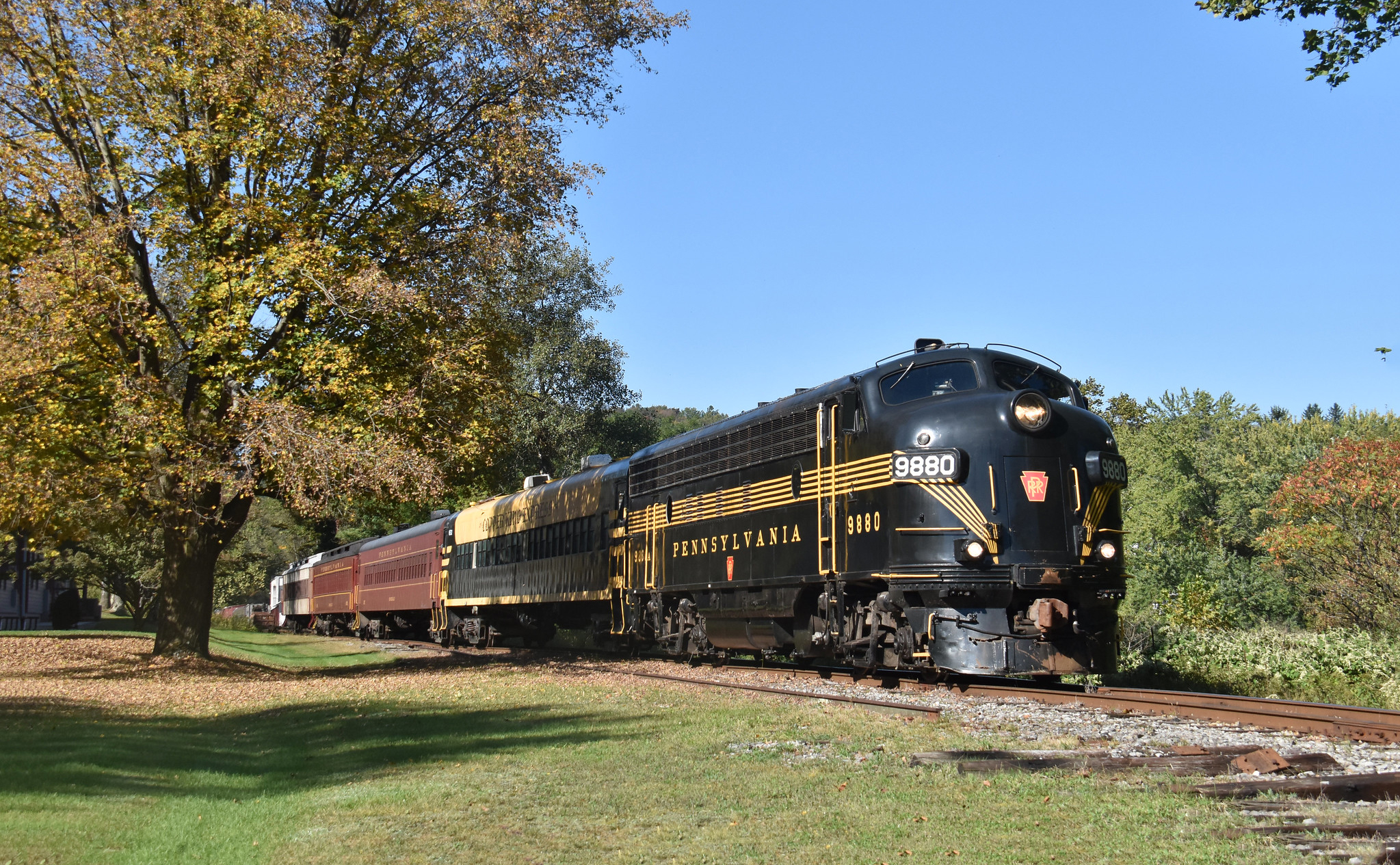 Stourbridge Line train along Lackawaxen River with Pennsylvania fall colors