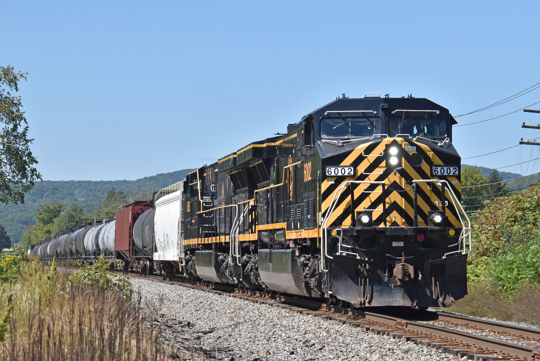 Western New York and Pennsylvania AC4460CW 6002 leading freight OL-3 eastbound near Allegany New York September 15 2023